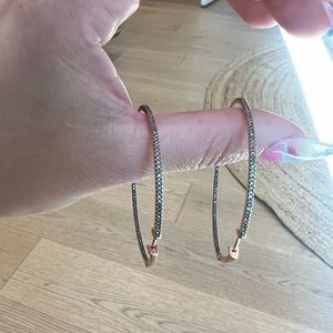 Rose gold hoop earrings with black diamonds